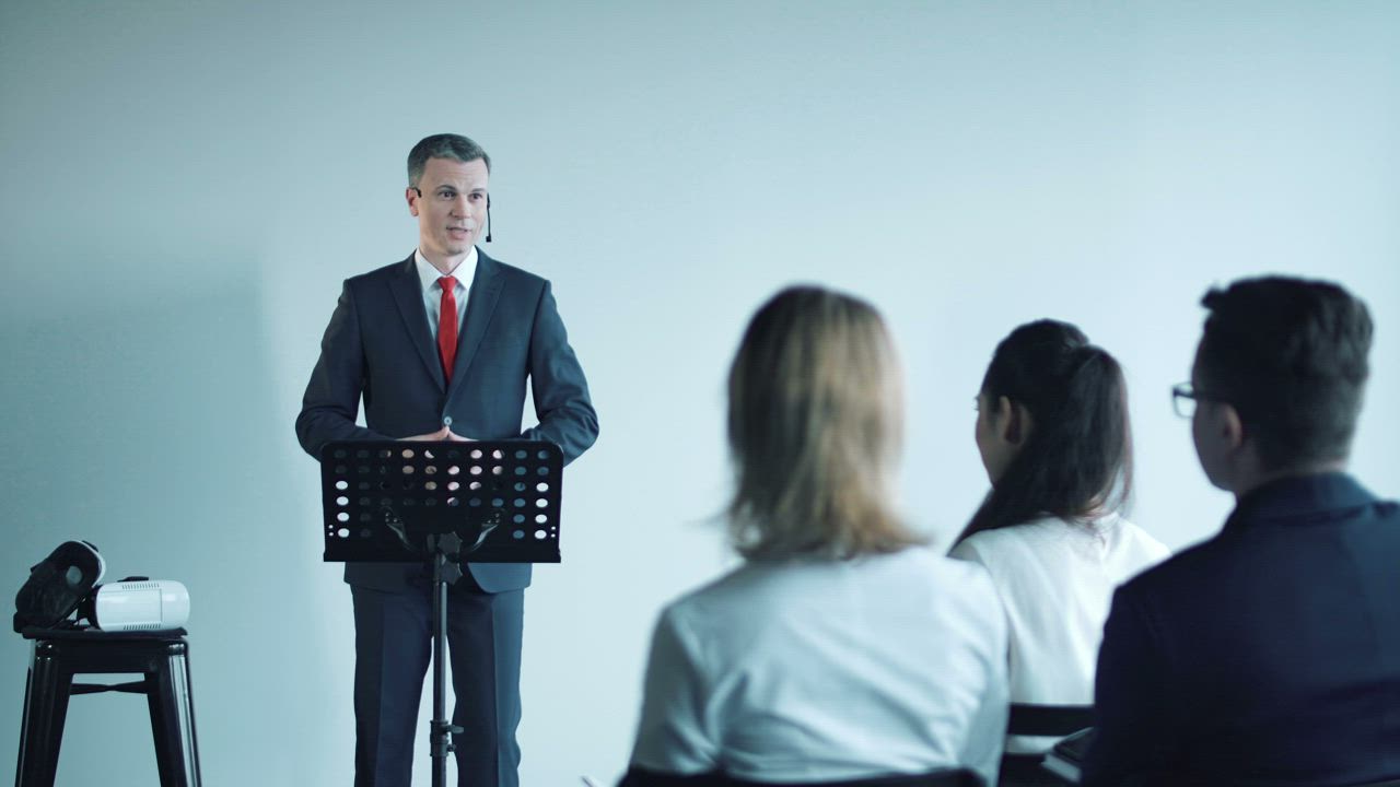 Speaker presenting to an audience